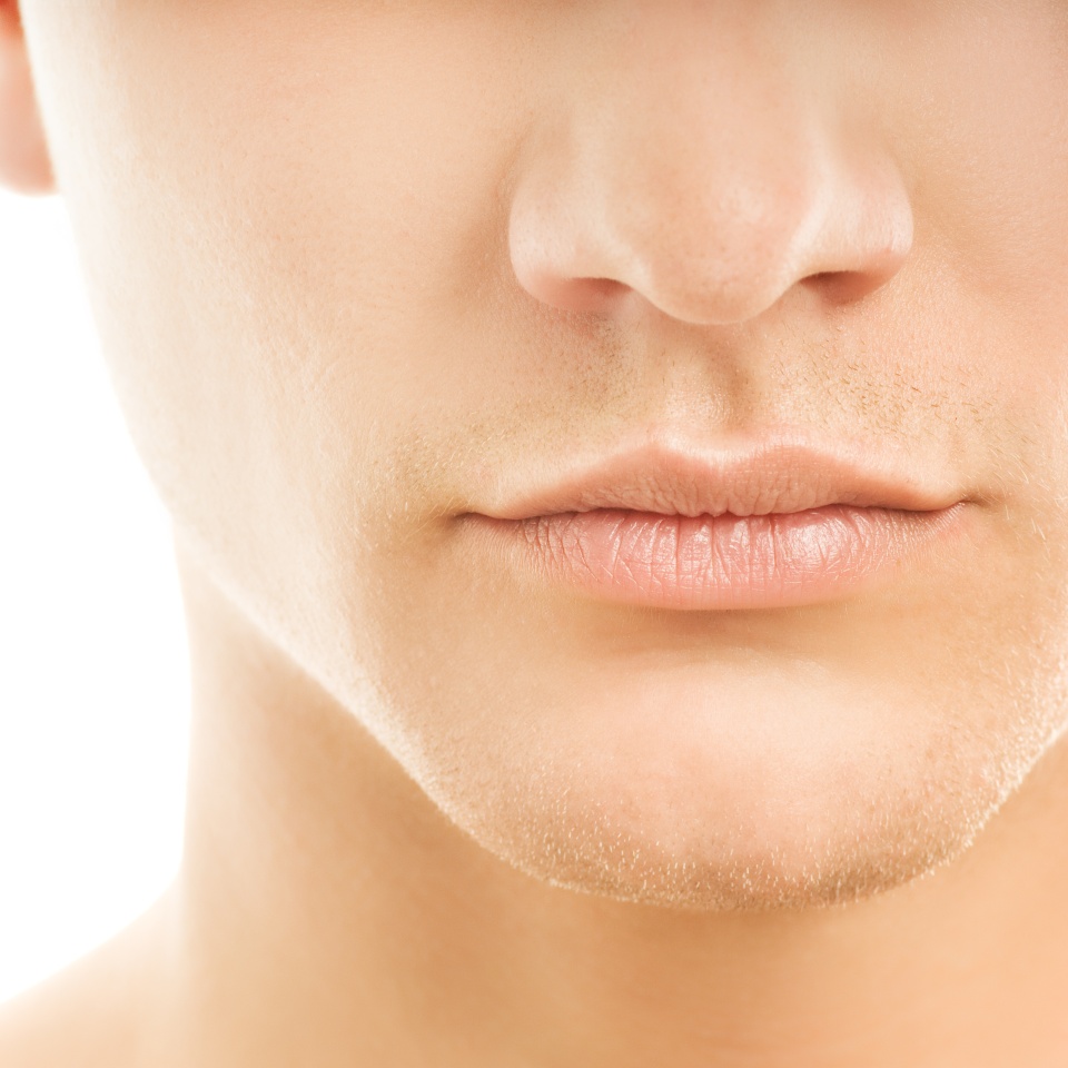 Close-up shot of a part of man's face. Isolated on white background