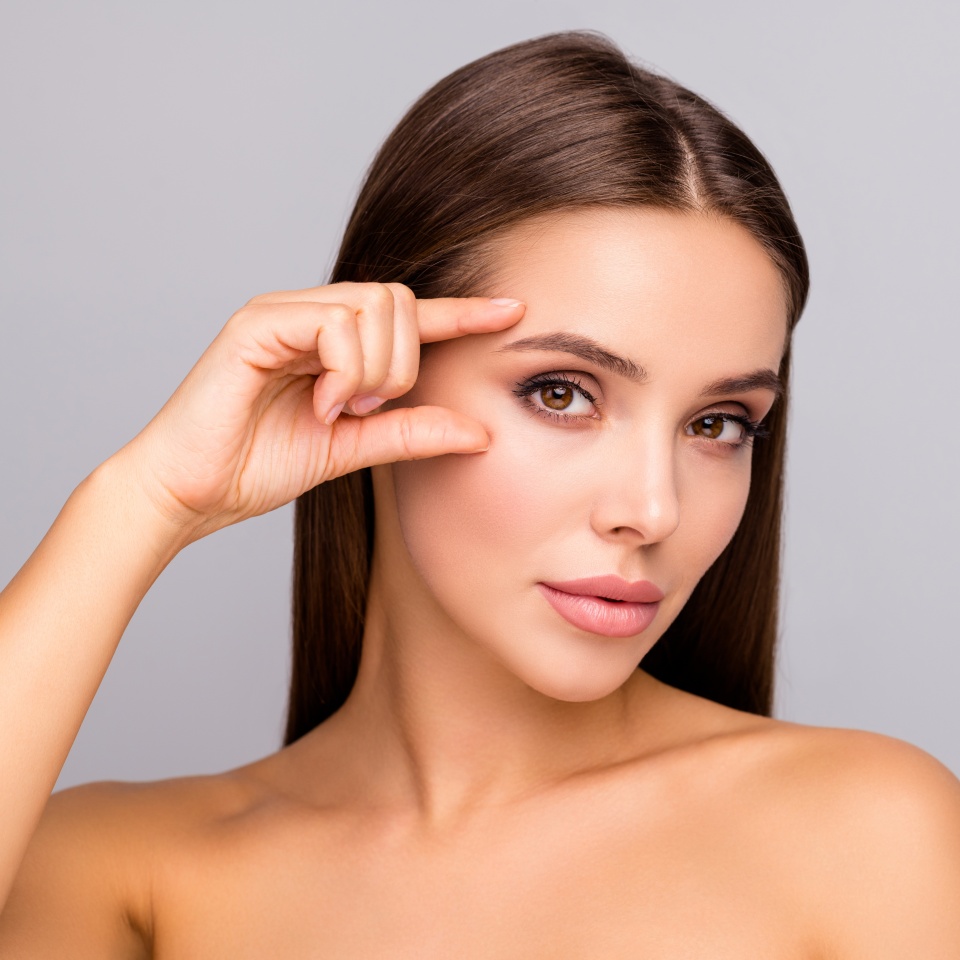 Closeup photo of beautiful lady nude naked shoulders plump shape lips tempting appearance fingers check eyebrow eye line no wrinkles face isolated grey color background