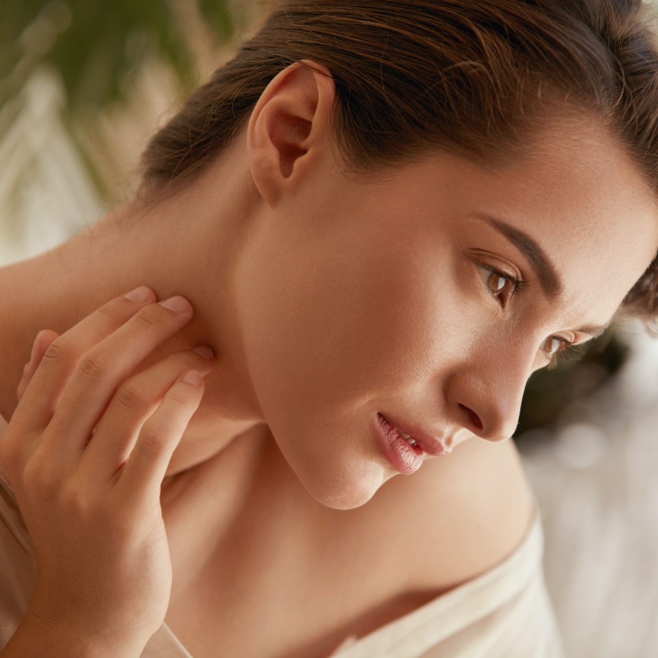 Beauty Face. Portrait Of Woman Touching Neck And Looking Away. Beautiful Model Enjoying Radiant And Glowing Facial Skin. Tender Brunette With Natural Makeup.