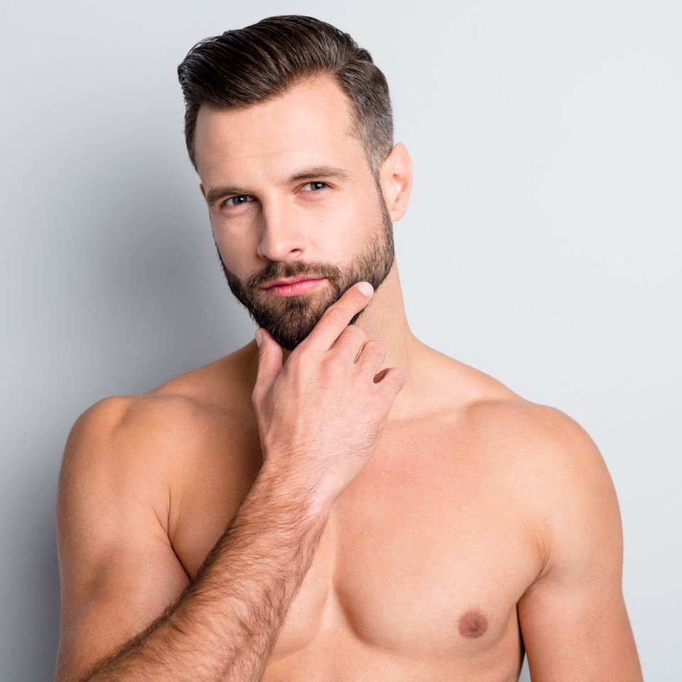 Close-up portrait of attractive content perfect well-groomed brunet guy touching chin isolated over light grey color background