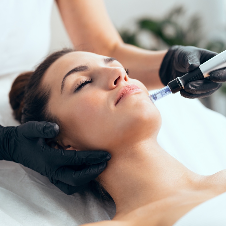 Shot of cosmetologist making mesotherapy injection with dermapen on face for rejuvenation on the spa center.