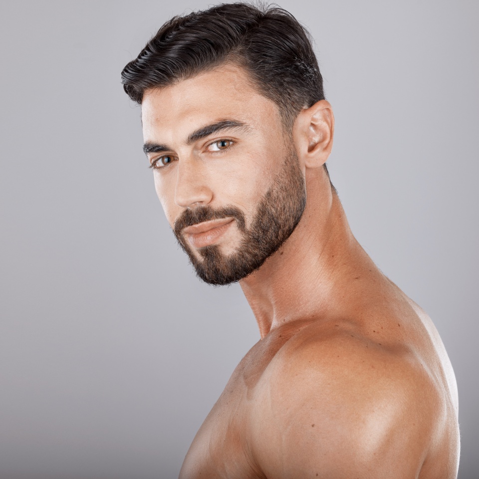 Man, studio portrait and skincare with beauty, cosmetics and wellness by studio backdrop with natural glow. Model, self care and healthy aesthetic for cosmetic self love, body care and radiant facial