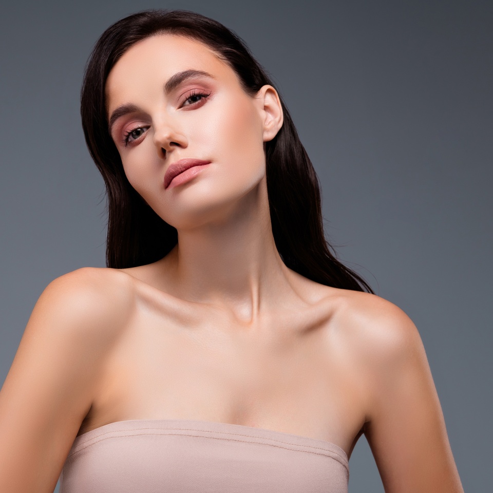 Photo of woman looking in camera beauty concept isolated grey color background