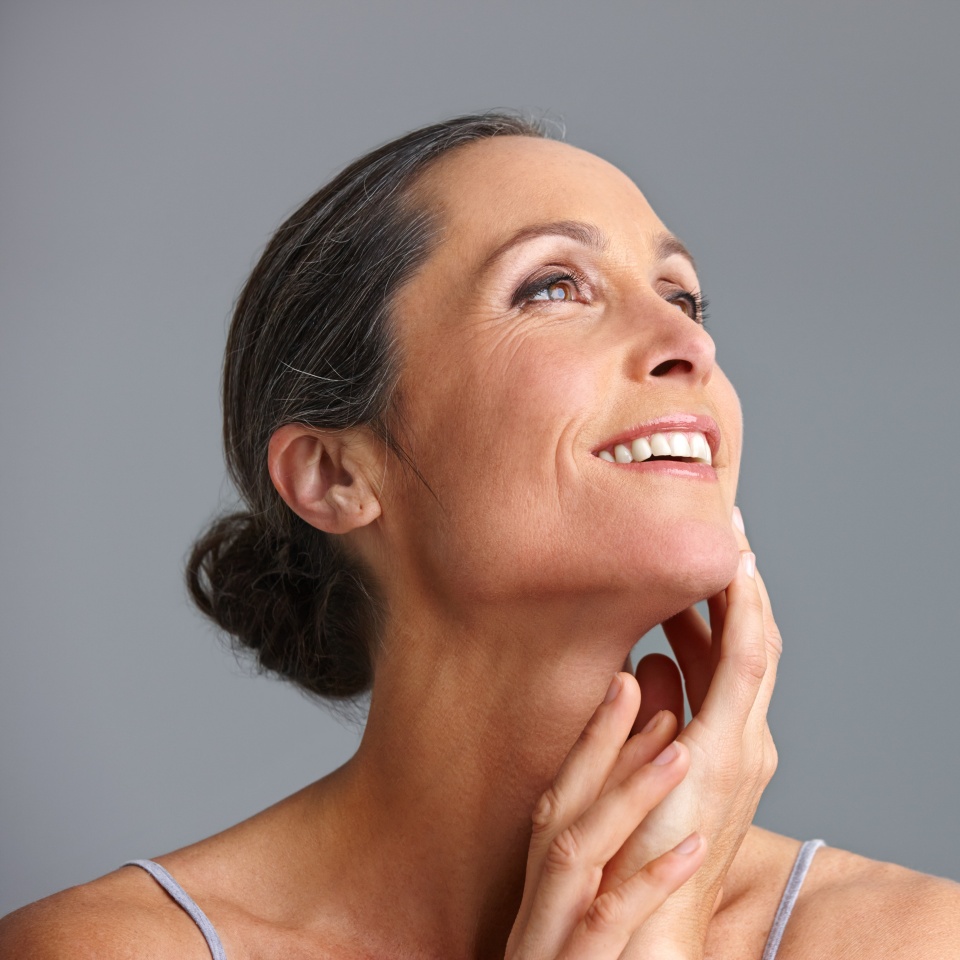 Mature woman, skincare and studio for thinking, confident collagen and beauty on gray background. Female person, feeling and results of antiaging treatment, mockup space and smooth for dermatology